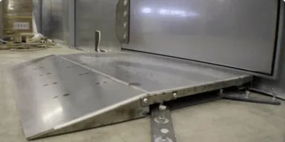 Faraday ramp doors for shielded cages