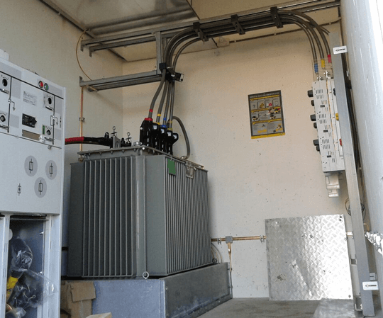 Middle voltage transformer with multi-layer redirection construction
